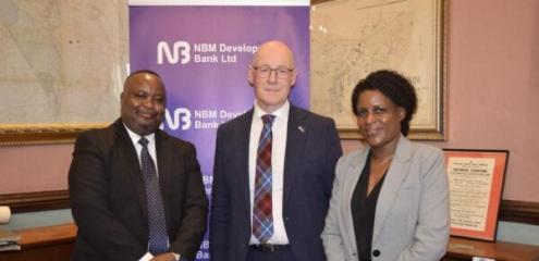 Swinney (centre) flanked by Masi (left) and NBM Development Bank Chief Operating Officer Esnat Kamudoni (right)